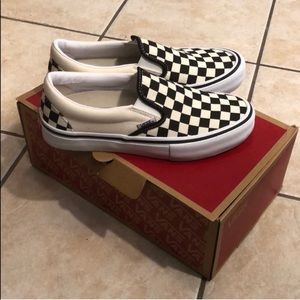 Checkered vans slip on